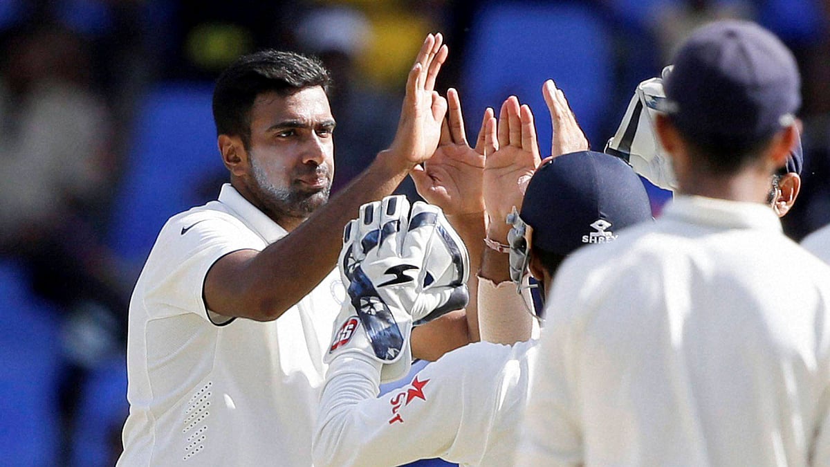 India’s off spinner Ravichandran Ashwin celebrates a wicket in 1st Test Match against West Indies at Antigua. (Photo: PTI)