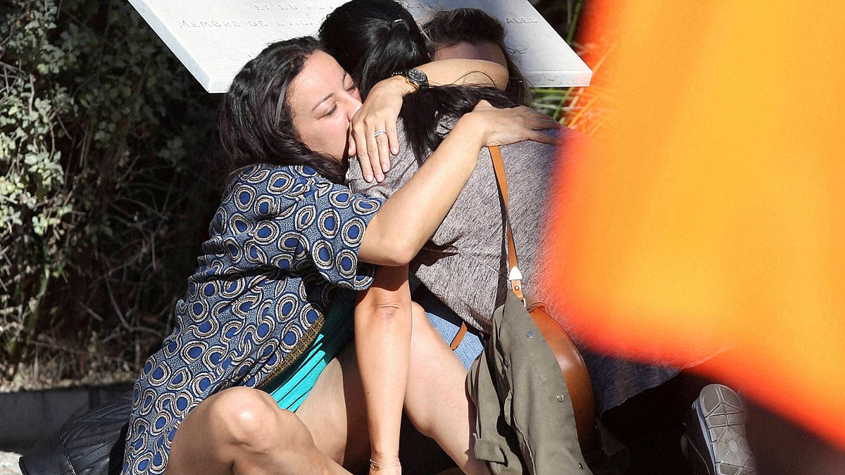 Parents of victims embrace each other near the scene of a truck attack in Nice, southern France, Friday, July 15, 2016. (Photo Courtesy: PTI) 