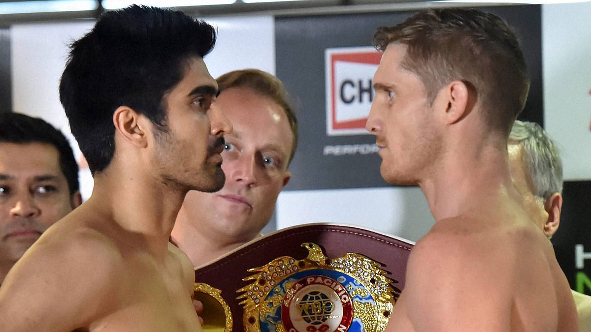 Vijender Singh and Kerry Hope face off after the official weigh-in session. (Photo: PTI)