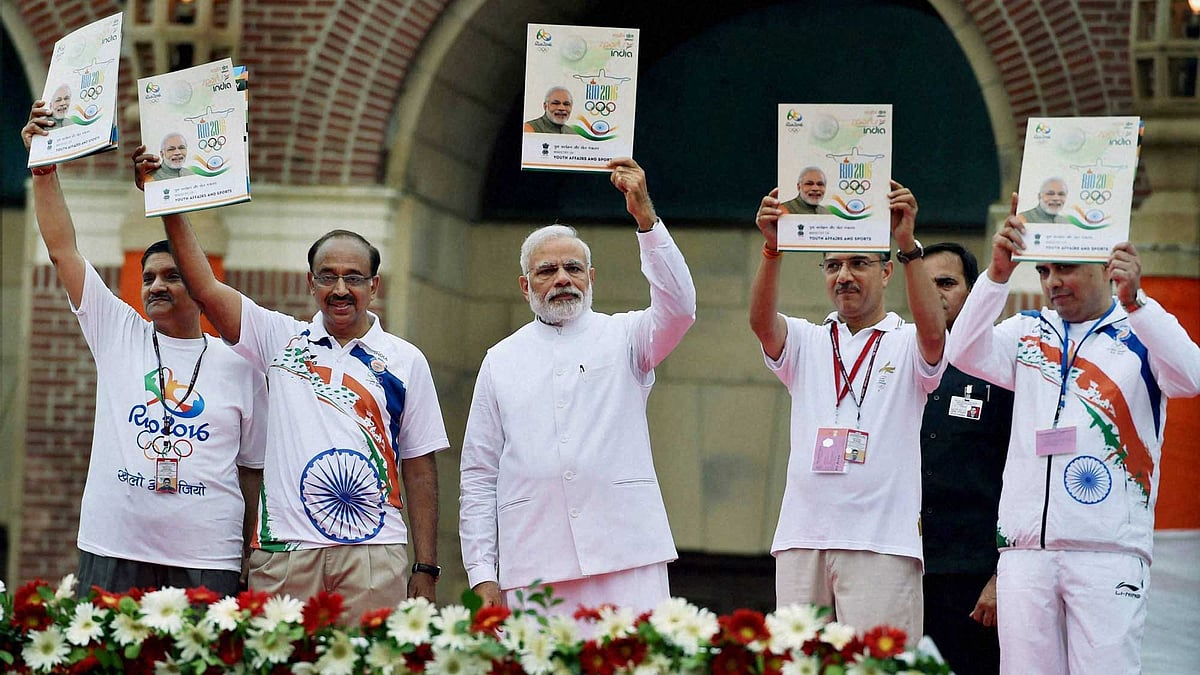File photo of PM Modi with Sports Minister Vijay Goel at an event to kick-off the Rio Olympics for the Indian contingent in New Delhi. (Photo: PTI)