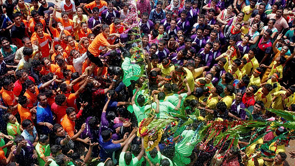 Devotees breaking the Dahi-Handi on the occasion of Janmashtami. (Photo: PTI)