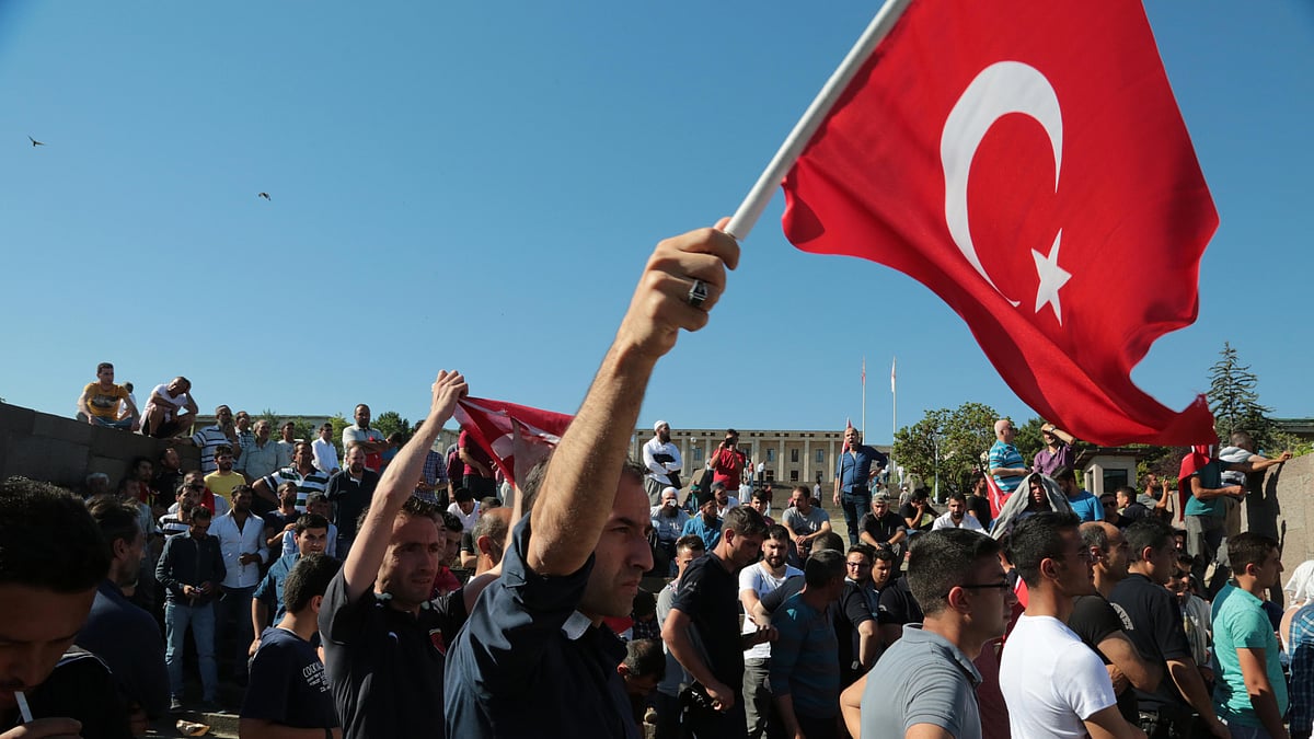 People protest against the coup outside the Parliament in Ankara. (Photo: AP)