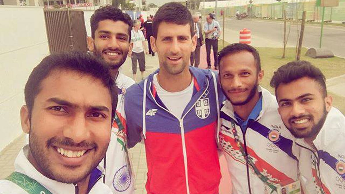Members of the Indian hockey team with the world number one tennis player Novak Djokovic. (Photo: Facebook/<a href="https://www.facebook.com/TheHockeyIndia/">Hockey India</a>)