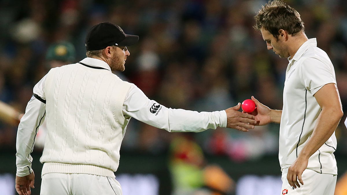 New Zealand skipper Brendon McCullum handing the pink ball to Doug Bracewell in the 1st ever pink ball test match between Australia and New Zealand. 