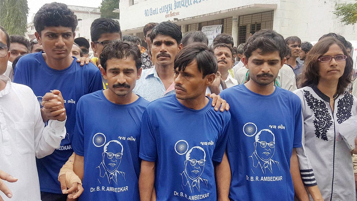 Four Dalit men who were attacked by self-proclaimed cow-vigilantes participate in a solidarity rally in Una, Gujarat on 15 August 2016. 