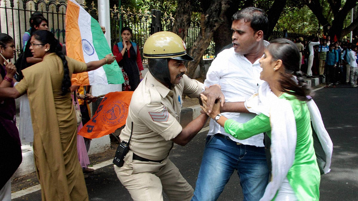 Police stop the students and activists who organised a rally in Bengaluru demanding a ban on Amnesty International. (Photo: <i>PTI</i>)