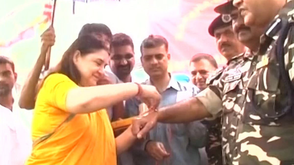 Ahead of the festival Maneka Gandhi ties rakhi to jawans (Photo: ANI Screengrab)