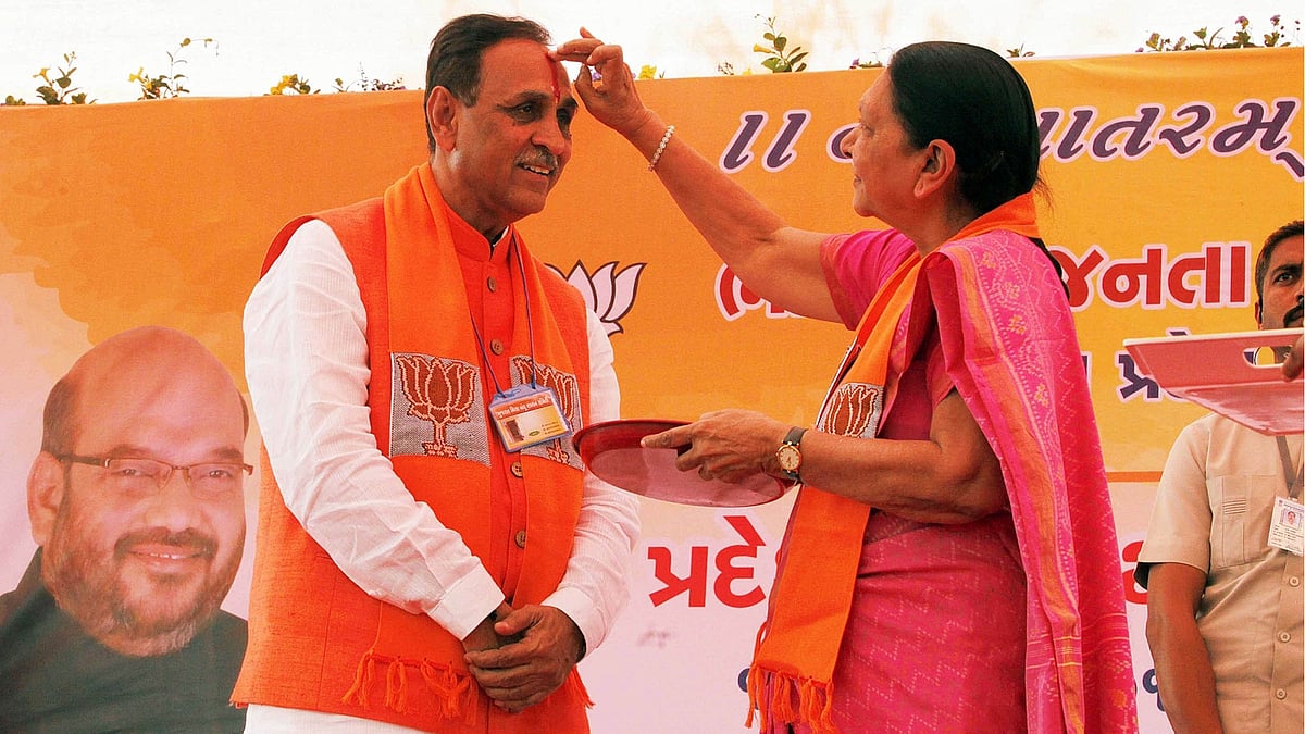 File photo of Former Gujarat Chief Minister Anandiben Patel greeting newly elected Chief Minister Vijay Rupani in Gandhinagar. (Photo: IANS)