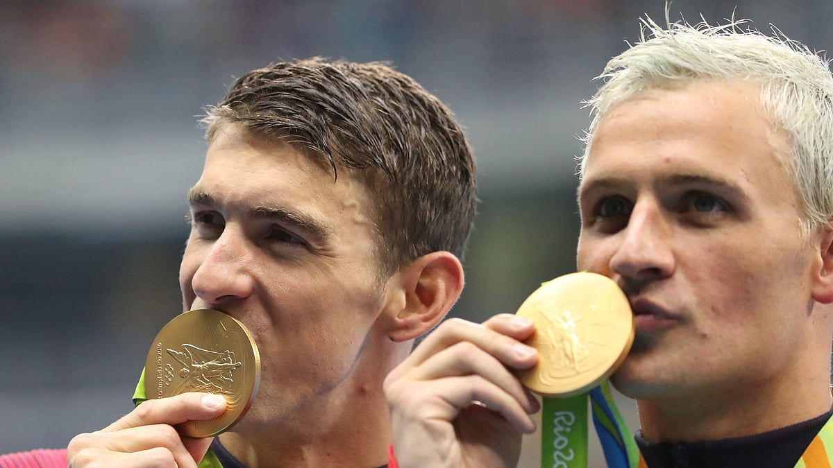 Armed robbers posing as police officers held a gun to the forehead of US gold medallist swimmer Ryan Lochte and his swimming teammates. (Photo: AP)