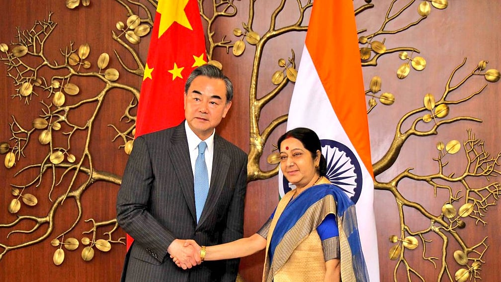 Chinese Foreign Minister Wang Yi with Indian Minister of External Affairs Sushma Swaraj. (Photo Courtesy: Twitter/<a href="https://twitter.com/MEAIndia">@MEAIndia</a>)