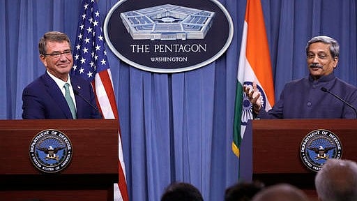 US Defence Secretary Ash Carter listens at left as Indian Defense Minister Manohar Parrikar speaks during their joint news conference at the Pentagon on Monday. (Photo: AP)