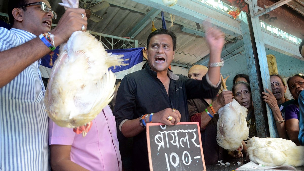 MNS workers demonstrate against meat ban for four days during “Paryushan” - Jain festival of forgiveness at Agar Bazar Market in Mumbai on Monday. (Photo: IANS) 