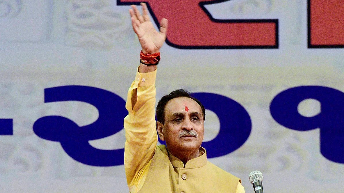 Gujarat Chief Minister Vijay Rupani waves at a gathering during his oath taking ceremony in Gandhinagar.