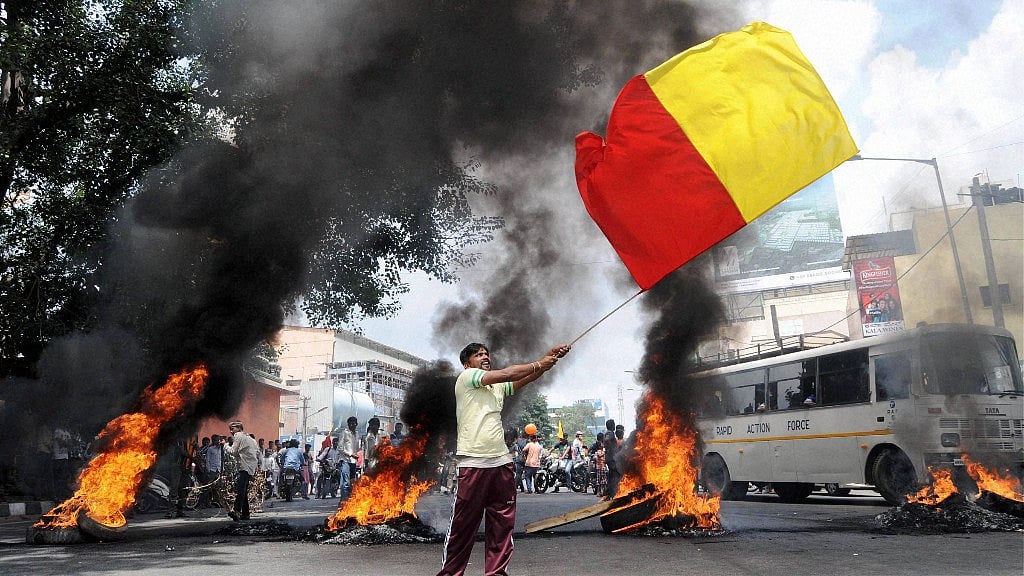 Protesters vandalised a bus stop and burned several vehicles in Bengaluru over the Cauvery dispute. (Photo: PTI)