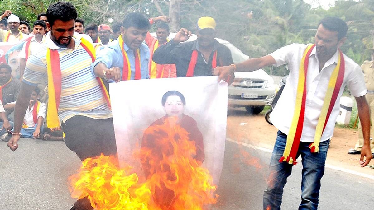 People stage a demonstration against releasing of Kaveri river water to Tamil Nadu on the Supreme Court’s directive to the Karnataka government in Bengaluru on Wednesday. (Photo: IANS)