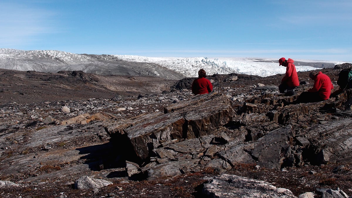 In this photo taken in July 2012, a field team examines rocks in Greenland. (Photo: AP)