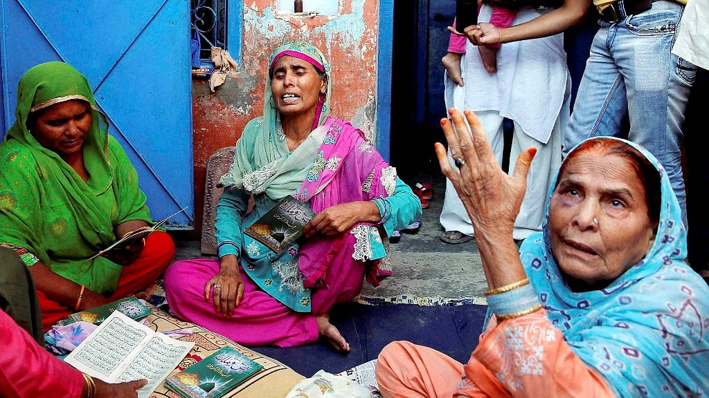 A file photo of Akhlaq’s relatives mourning his death at his home. (Photo: PTI)