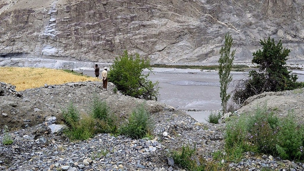 The landslide cut through the heart of their fields; the rubble was once all working farms