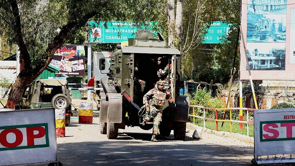 Army personnel in action inside the army brigade camp during the Uri attack. (Photo: PTI)