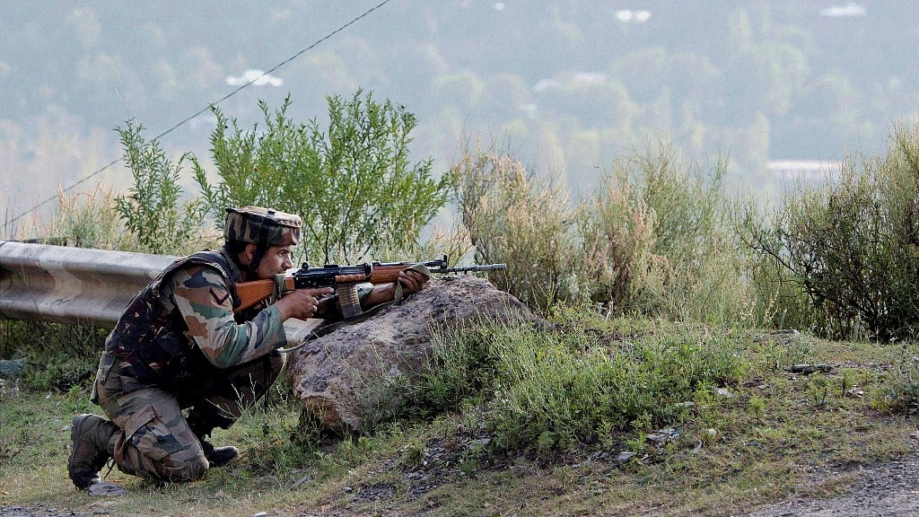 

A soldier takes position near Army Brigade camp during a terror attack in Uri, Jammu and Kashmir on Sunday. (Photo: PTI)