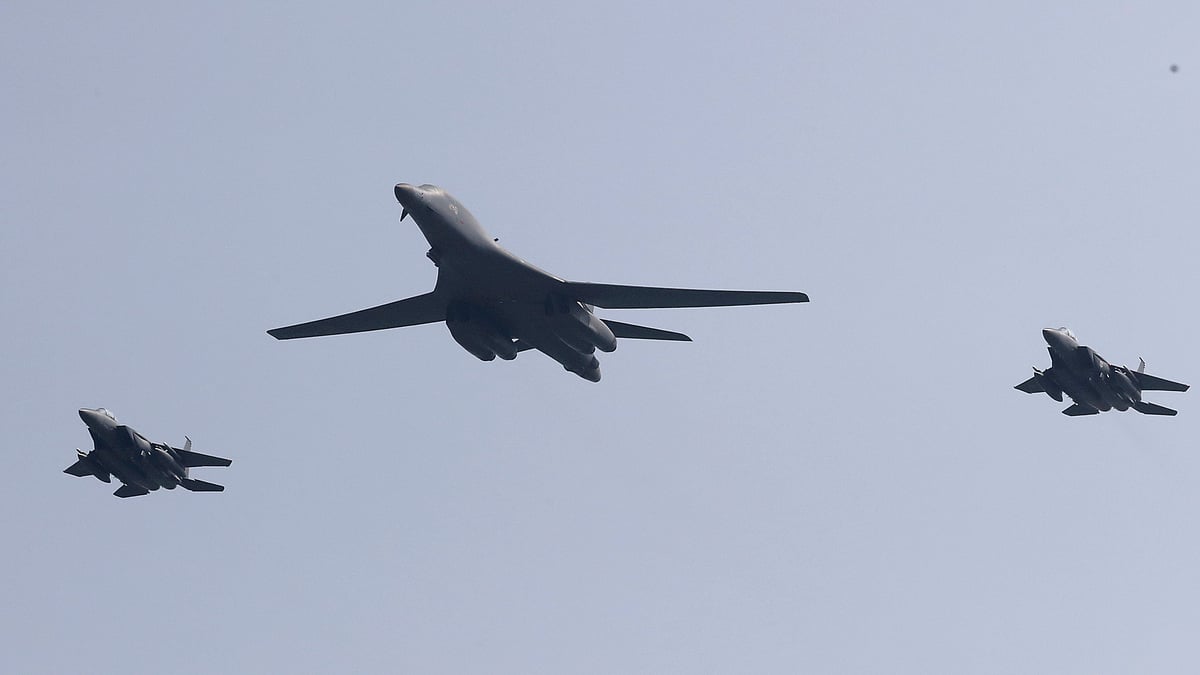 A US B-1 bomber (centre) flies with South Korean jets over Osan Air Base in South Korea on Tuesday. (Photo: AP)