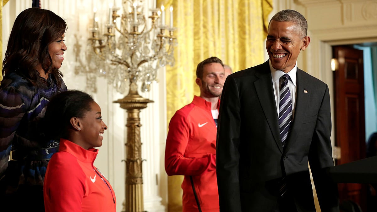 An elated Simone Biles with the US President Obama and the First Lady. (Photo: Reuters)
