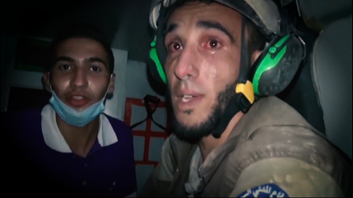 The rescue volunteer from the White Helmets cried after rescuing the baby girl who was buried under the rubble for two hours after the airstrike. (Photo Courtesy: AP Screengrab)