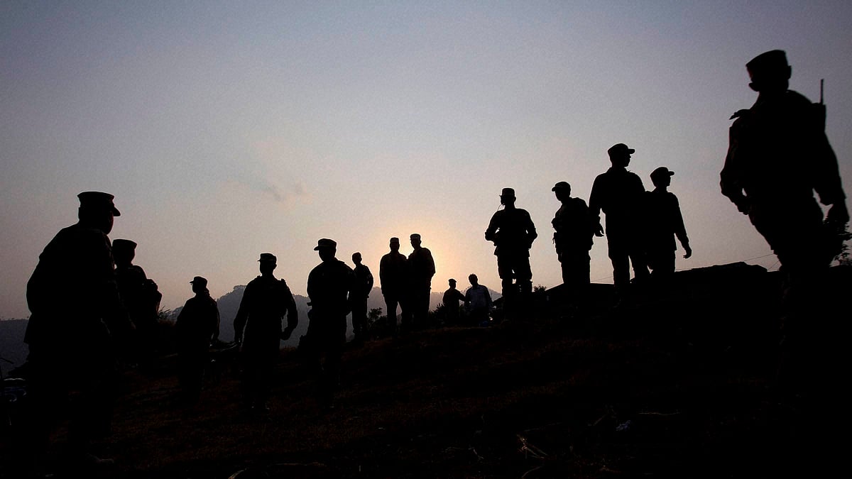 Pakistan army soldiers gather at a forward area post along the Line of Control (LoC), that divides Kashmir between Pakistan and India. (Photo: PTI)