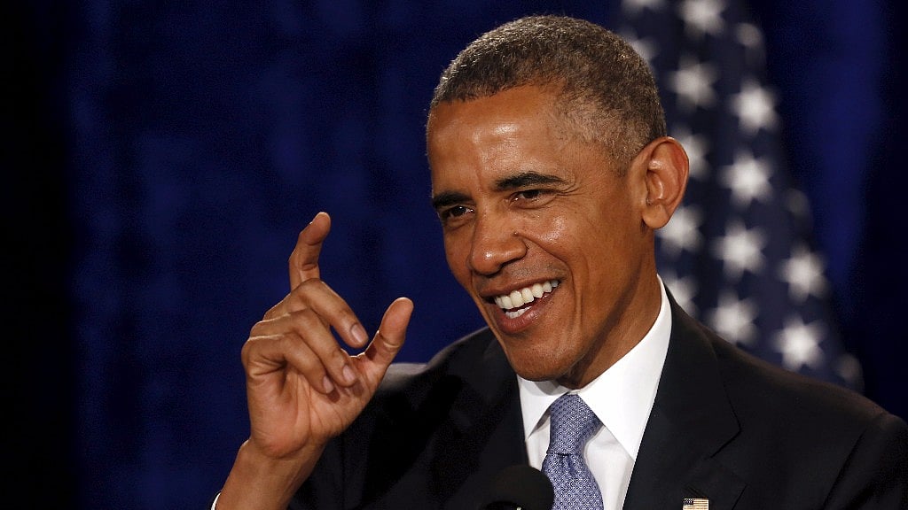 US President Barack Obama directs supporters to finish taking their selfies so he can begin his remarks at an Organizing for Action summit in Washington. (Photo: Reuters)
