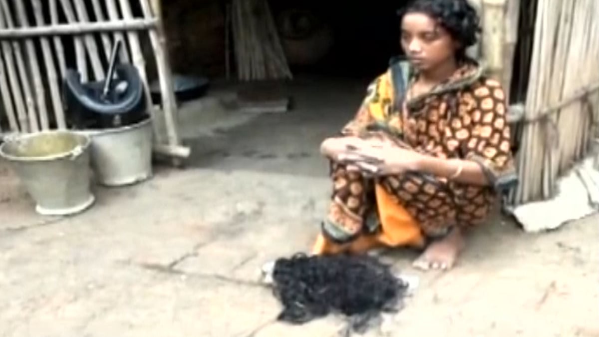 A kangaroo court in West Bengal’s Murshidabad district forced a man to trim his wife’s hair. (Photo: ANI screengrab)
