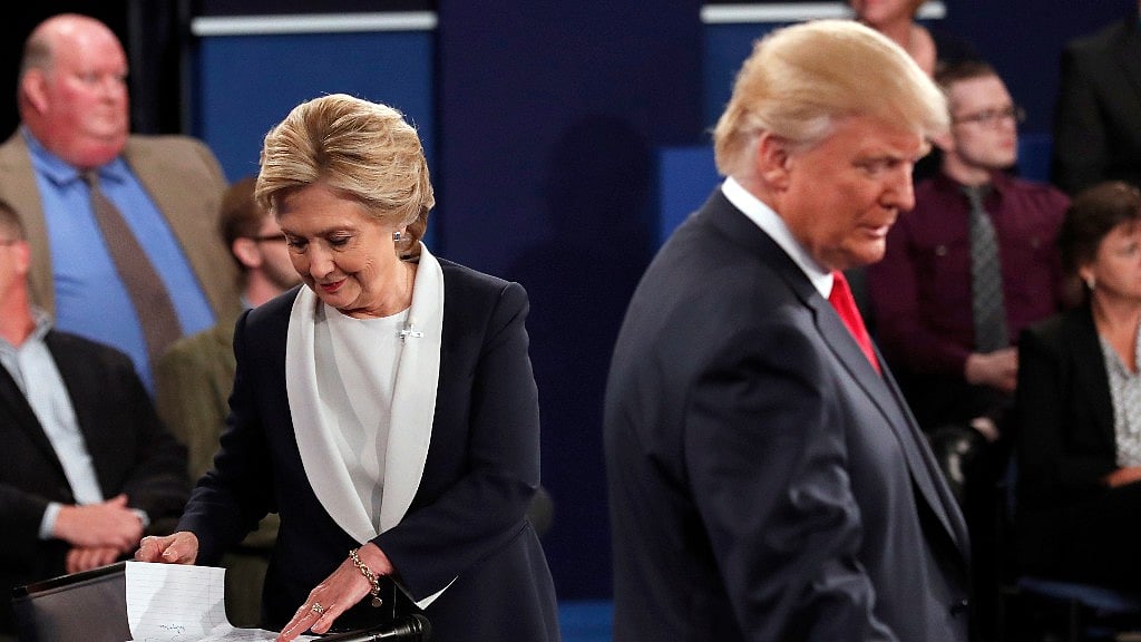 Hillary Clinton and Donald Trump go to their table after the second presidential debate at Washington University in St Louis on Sunday, 9 October 2016. (Photo: AP)