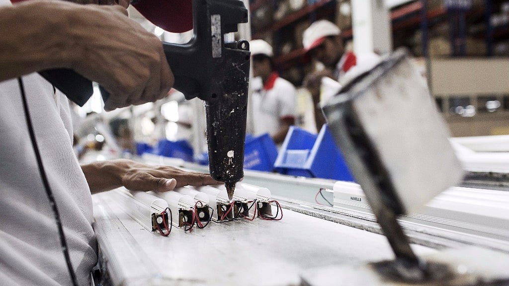 A worker at a light-emitting diode fixture assembly unit. (Photo: Udit Kulshrestha/Bloomberg)