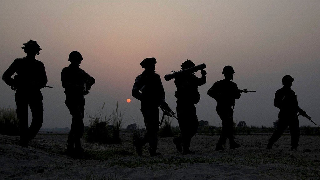 Indian soldiers patrol near the Line of Control in Pallanwal sector in Jammu and Kashmir on 4 October 2016. (Photo: PTI)