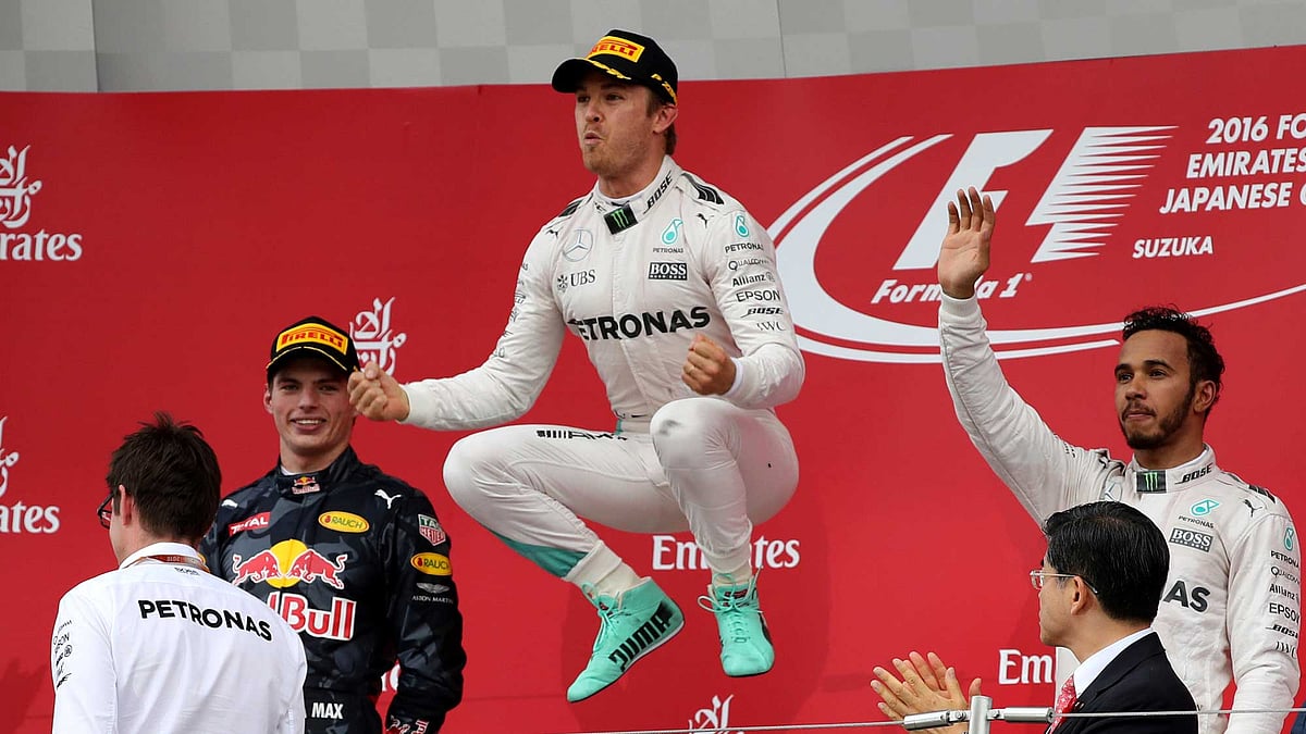 Mercedes driver Nico Rosberg, centre, of Germany celebrates on the podium after winning the Japanese Formula One Grand Prix at the Suzuka International Circuit in Suzuka, Japan. (Photo: AP)