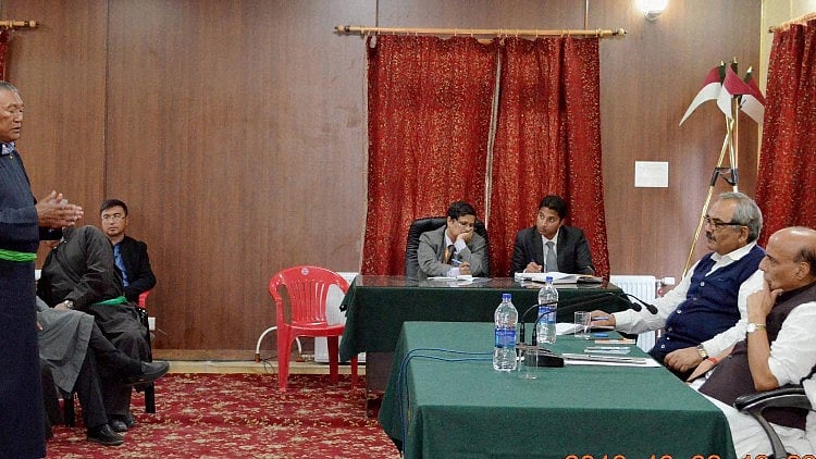 Union Home Minister Rajnath Singh meeting with the representatives of over 15 political parties, religious communities and civil society groups in Leh, Jammu and Kashmir. (Photo: PTI) 