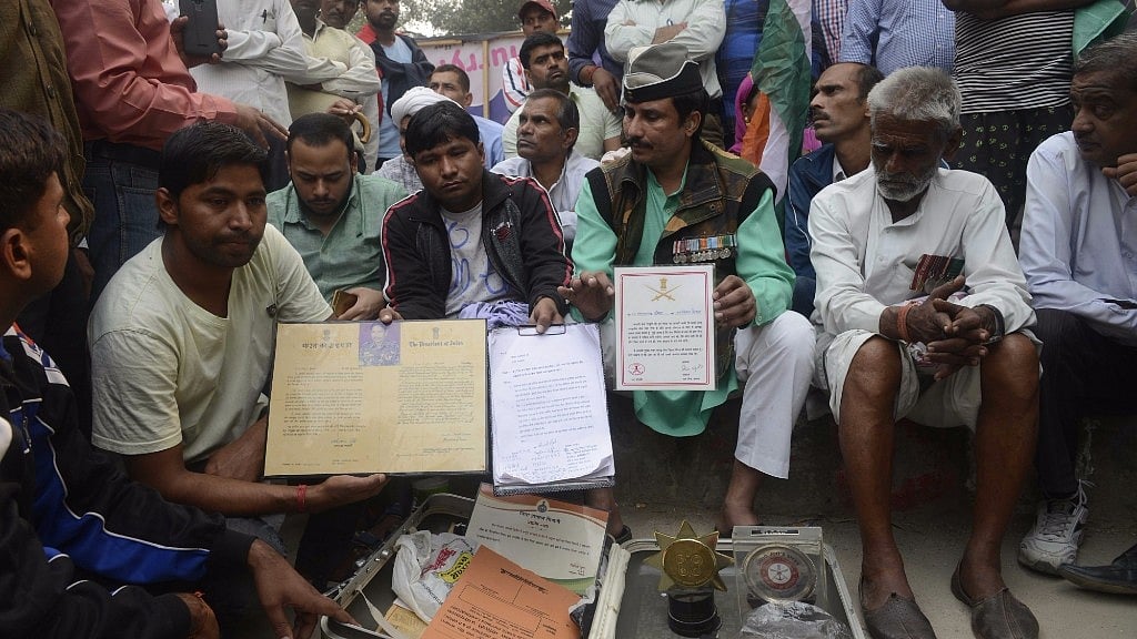 Family members of retired soldier Ram Kishan Grewal who committed suicide demanding OROP’s implementation outside Ram Manohar Lohia Hospital in New Delhi (Photo: IANS)