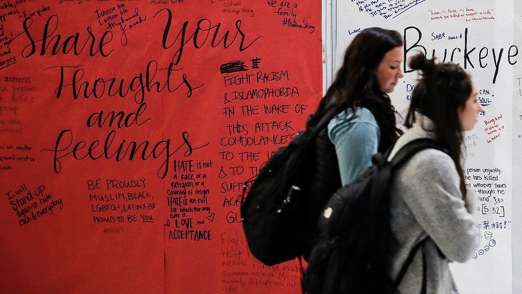 A message board covered in community reactions stands in the main hall following an attack at Ohio University campus. (Photo: AP)