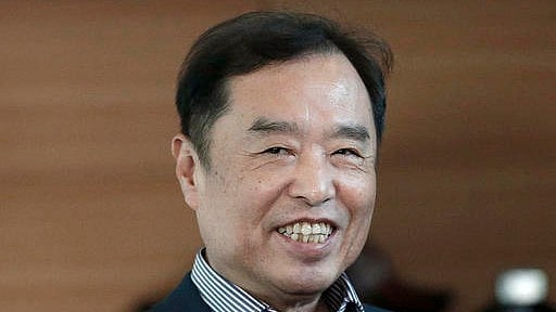 Kim Byong-joon, who was nominated Prime Minister by South Korean President Park Geun-hye, smiles as he arrives at his office in Seoul, South Korea. (Photo: AP)