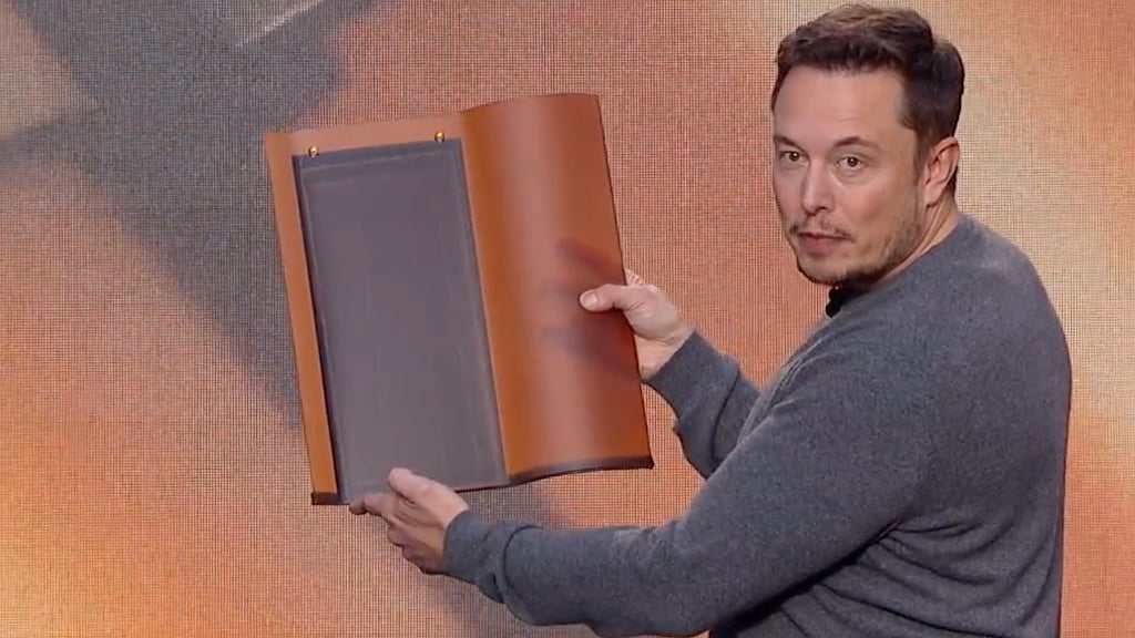 Elon Musk demonstrates some of his solar tiles. (Photo Courtesy: Screenshot from Tesla Video)