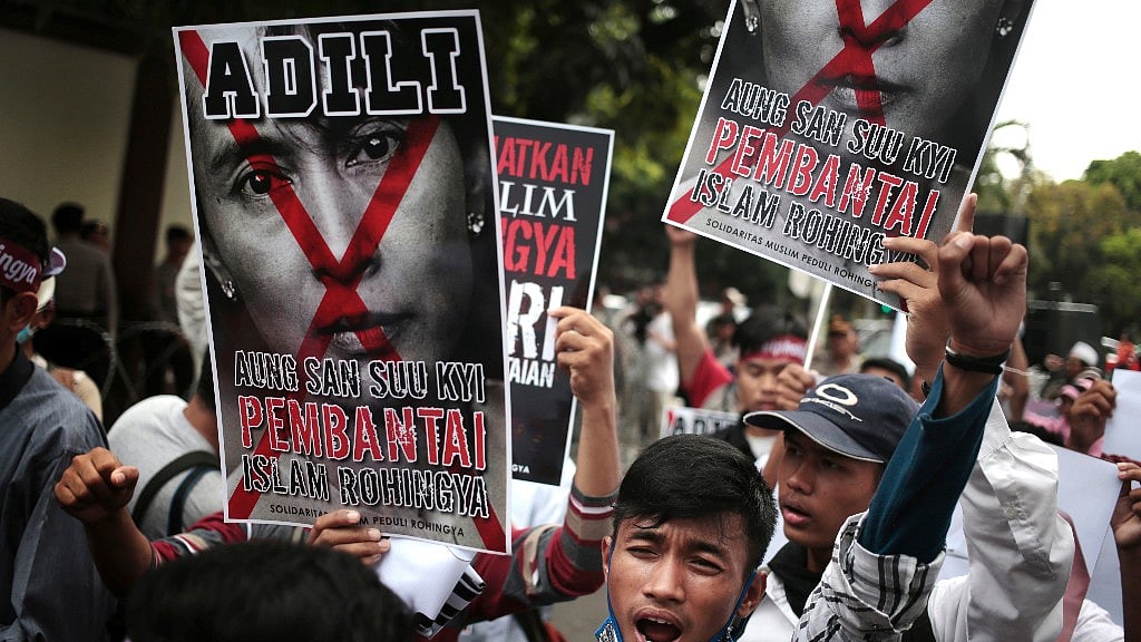 A Muslim man shouts slogans as he holds a defaced poster of Myanmar’s Foreign Minister Aung San Suu Kyi during a rally against the persecution of Rohingya Muslims. (Photo: AP)