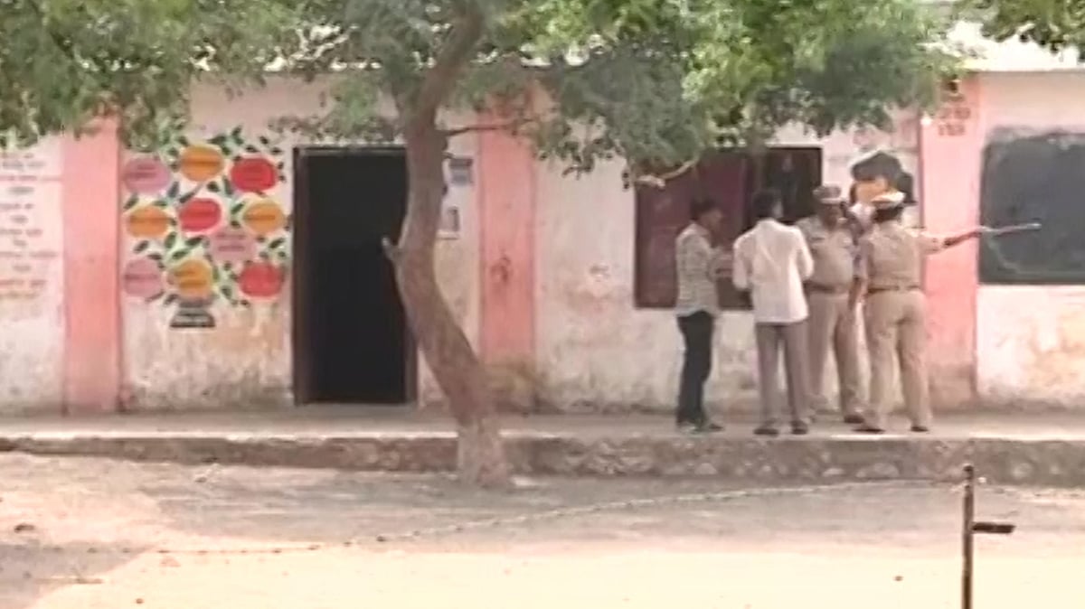 Police question school staff in Buldhana on Friday. (Photo: ANI Screengrab)