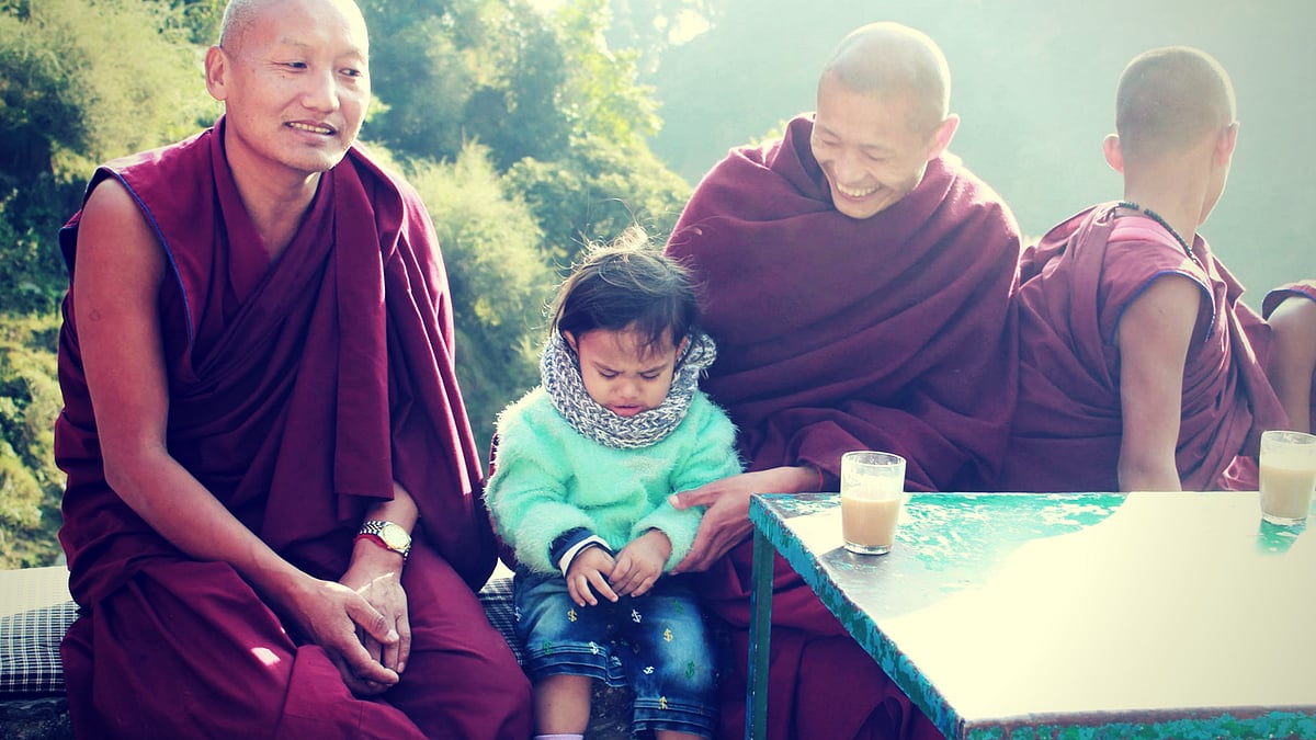 My toddler, unable to tell the monks our money woes. (Photo Courtesy: Runa Mukherjee Parikh)