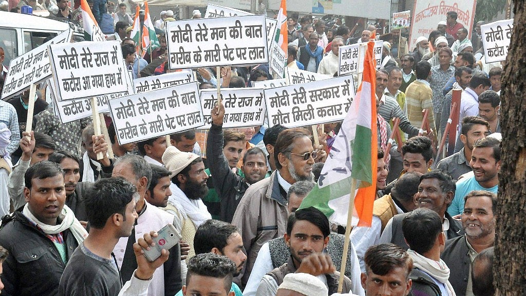 Congress workers protesting against demonetisation in Moradabad on Monday. (Photo: PTI)
