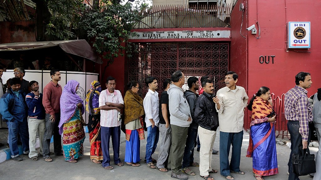 Serpentine queues and cashless ATMs. (Photo: AP)