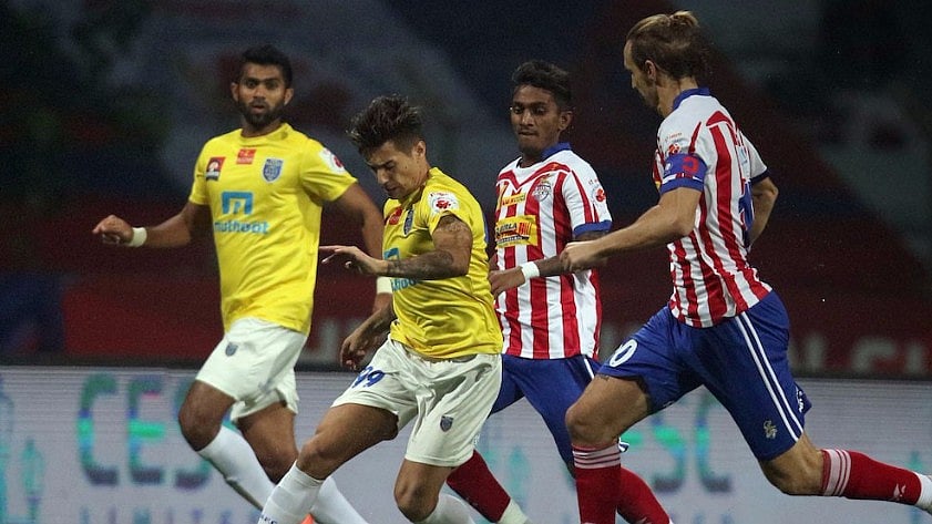 Josu Currais of Kerala Blasters FC tries to dribble ahead as Borja Fernandez and Abinash Ruidas of Atletico de Kolkata run after him during a match in the league phase. (Photo: Indian Super League)