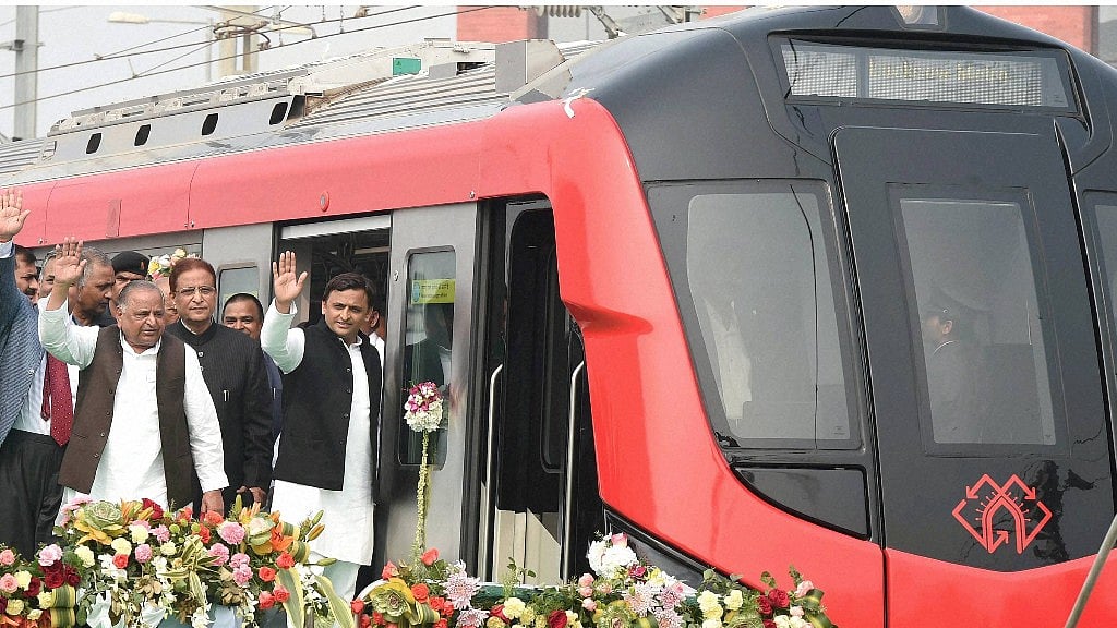 Uttar Pradesh Chief Minister Akhilesh Yadav and his father, SP supremo, Mulayam Singh Yadav inaugurate Lucknow metro rail. (Photo: PTI)