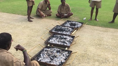 The groundstaff at the Chepauk stadium in Chennai were on Wednesday seen using burning coal to dry the pitch. (Photo Courtesy: <a href="https://twitter.com/nassercricket">Twitter/Nasser Hussain</a>)