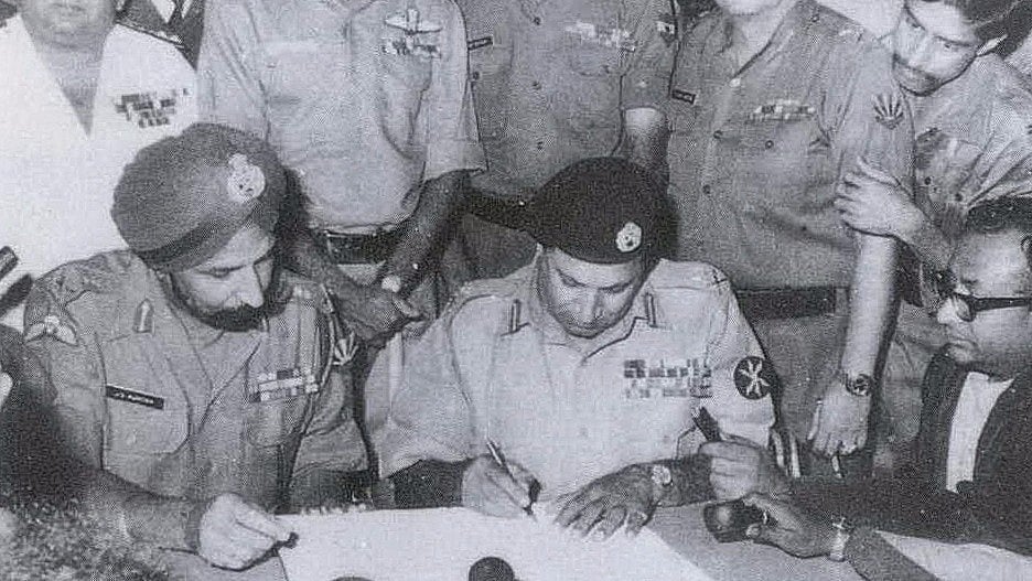 Lt General Auroa of Indian Army and Lt General Niazi of Pakistan army signing the instrument of surrender.