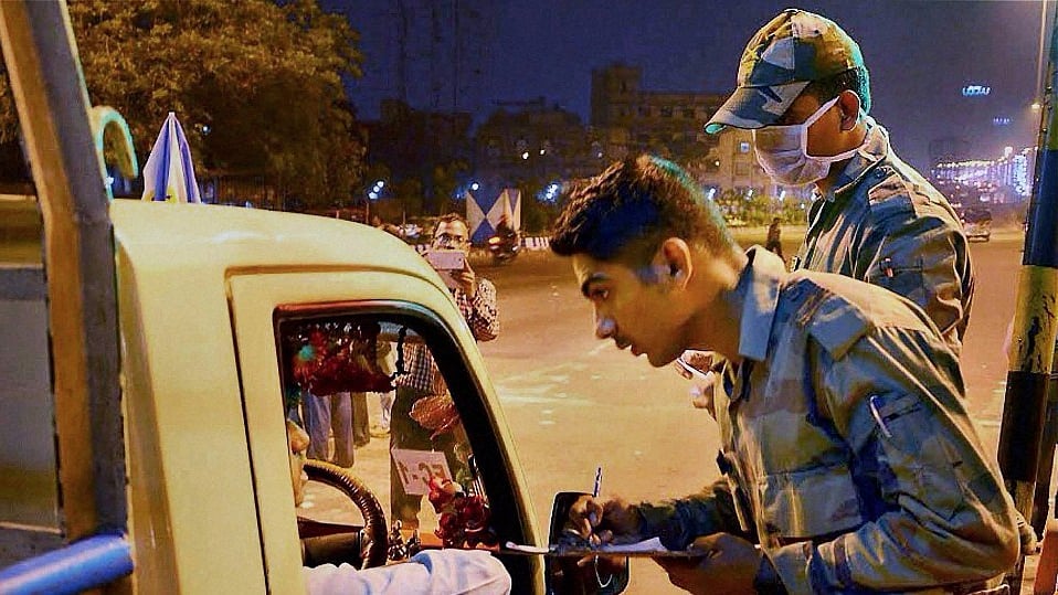 Army jawans check vehicles at the toll plaza at Vidyasagar Setu near Nabanna (State Secretariat) in Kolkata on Thursday. (Photo: PTI)