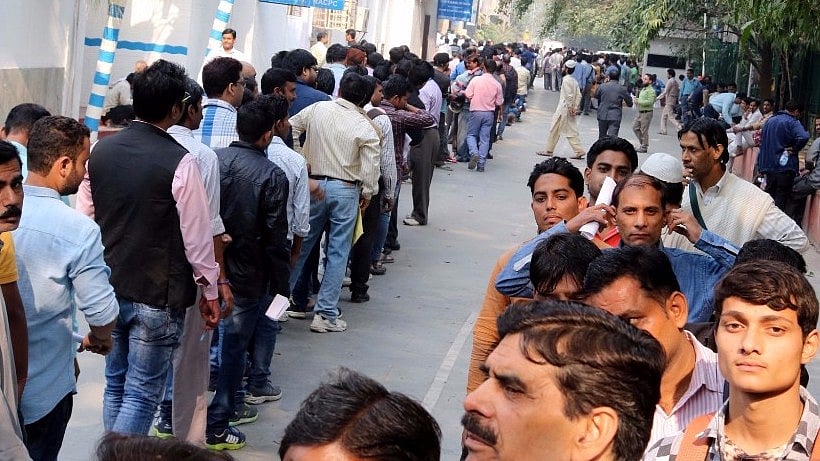 People queue up in front of ATMs. Image used for representational purposes. (Photo: IANS)